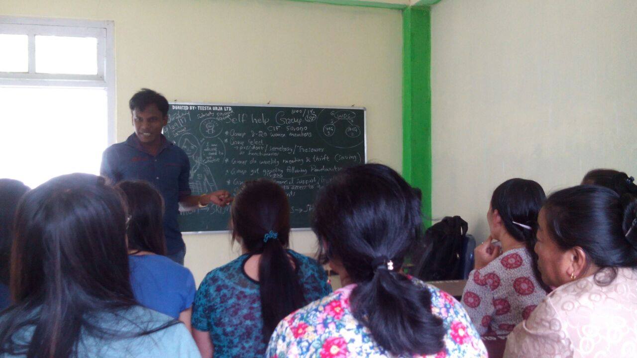 SHG members being trained by Mentor